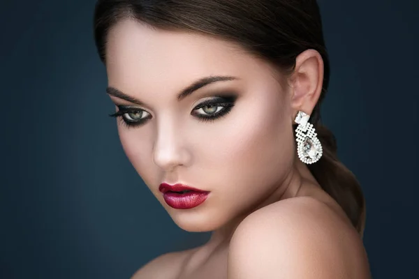 Young woman with beautiful earrings