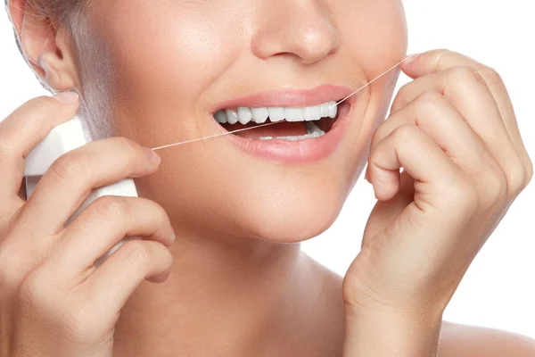 Woman and dental floss — Stock Photo, Image