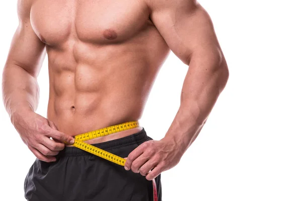 Male torso and measuring tape — Stock Photo, Image