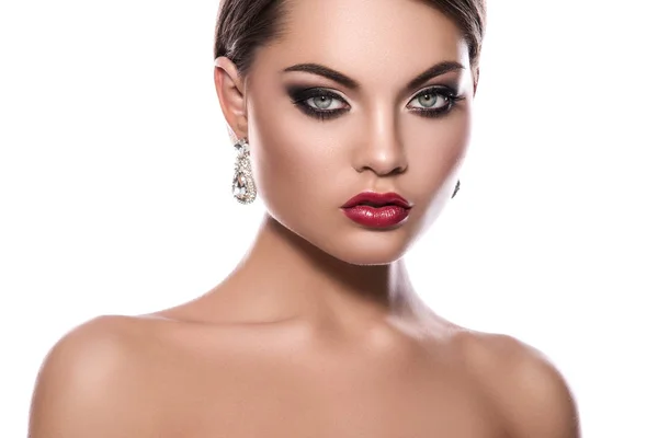 Portrait of young woman with beautiful earrings — Stock Photo, Image