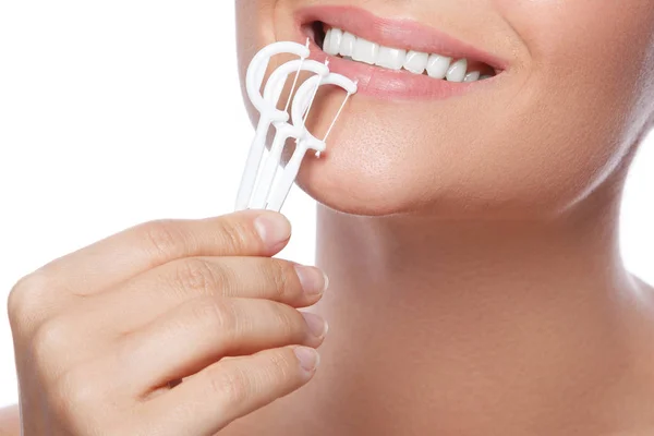 Woman and dental floss picks — Stock Photo, Image