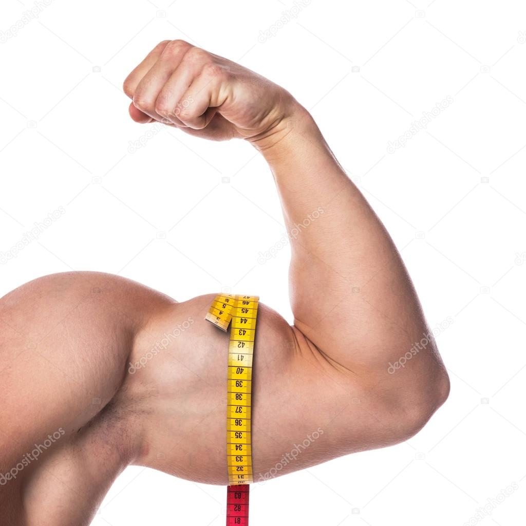 Male biceps and measuring tape
