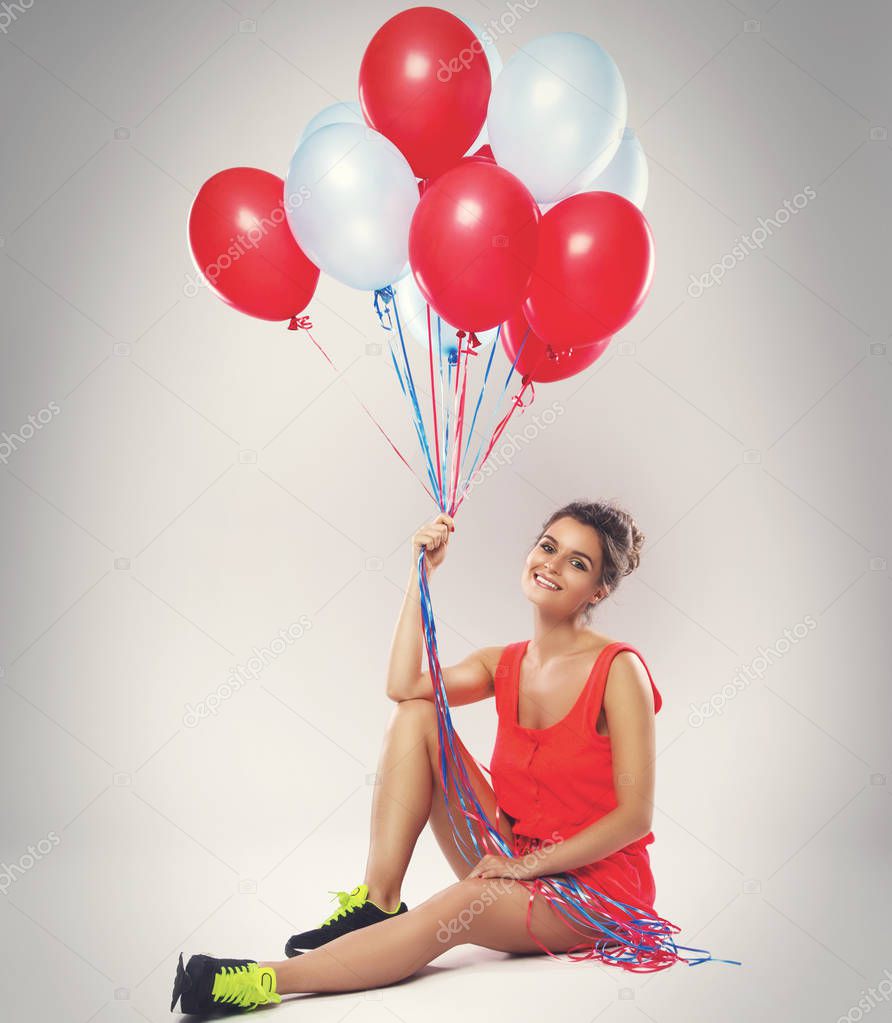 woman with colorful balloons