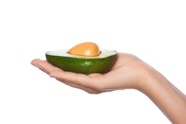 Female hand with fresh avocado — Stock Photo, Image