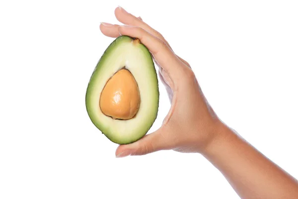 Female hand with fresh avocado — Stock Photo, Image
