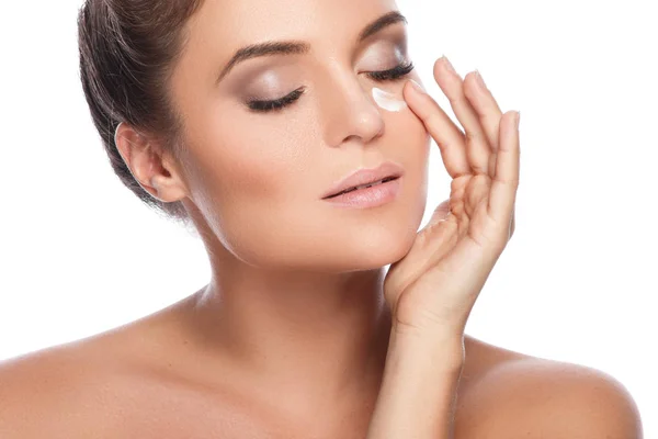 Woman applying moisturizing cream — Stock Photo, Image