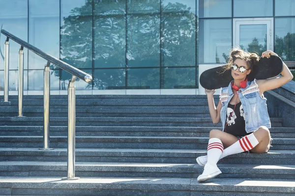 Stylish girl with skateboard — Stock Photo, Image