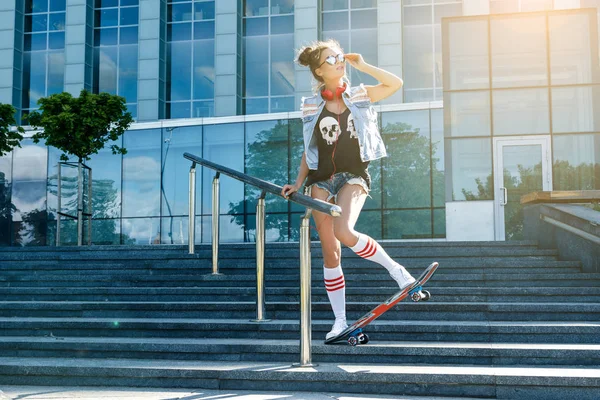 Stylish girl with skateboard — Stock Photo, Image