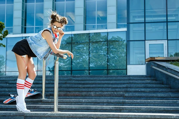 Stylish girl with skateboard — Stock Photo, Image