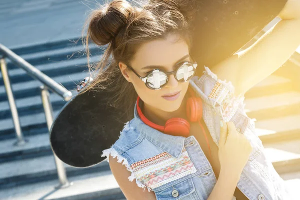 Stylish girl with skateboard — Stock Photo, Image