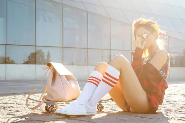 Stylish girl with skateboard — Stock Photo, Image