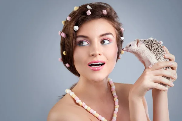 Young woman with small hedgehog — Stock Photo, Image