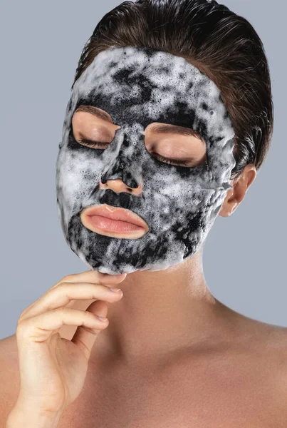 Young Woman Bubble Sheet Mask Her Face Gray Background — Stock Photo, Image