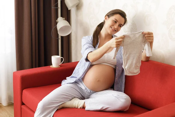 Young Pregnant Woman Looking Bodysuit Her Future Baby — Stock Photo, Image