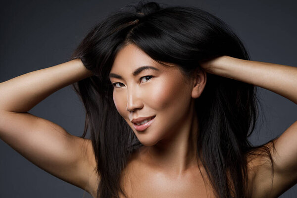 Portrait of beautiful asian woman with a black healthy hair