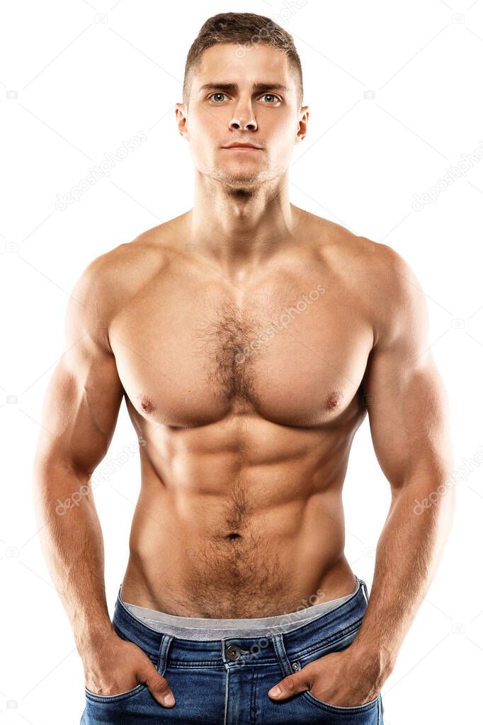 Handsome muscular guy is posing on white background