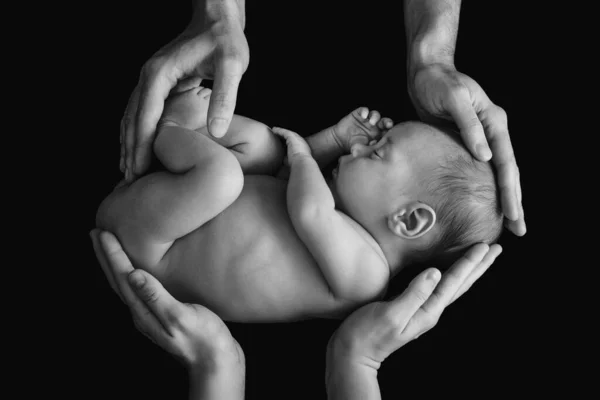 Cute Newborn Baby Father Mother Hands Black Background — стоковое фото