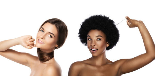 Caucasian and African girls. Comparison of different types of hair and skin tones. Isolated; on white background.