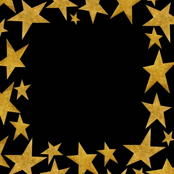 Quadratischer Rahmen mit goldenen Metallsternen auf schwarzem Hintergrund. — Stockfoto