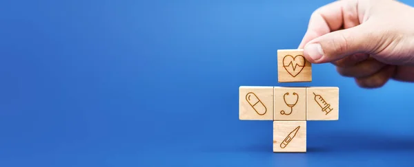 Medical background. Medical symbols on wooden blocks. pharmaceutical concept. Problems of treatment and health.