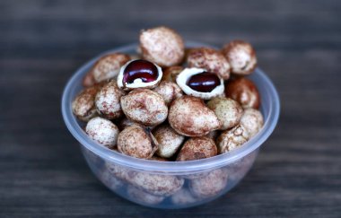 Bambara groundnut or Vigna subterranea (Kacang Bogor) on wood background. clipart