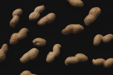 Macro peanuts on black background