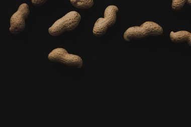 Macro peanuts on black background