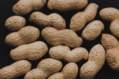Macro peanuts on black background