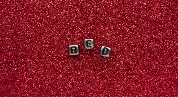 Slovo Červená Kostek Písmeny Červené Třpytky Pozadí — Stock fotografie