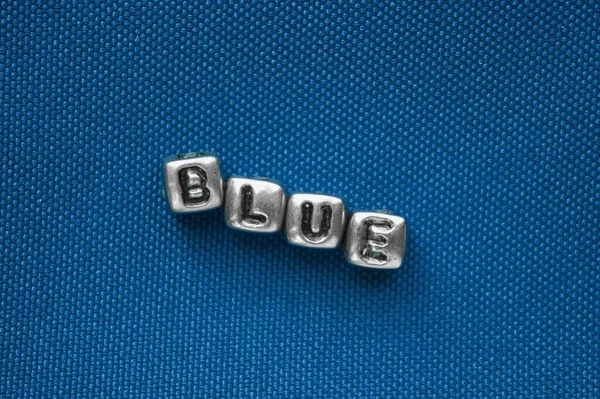 Slovo Modré Kostek Modrém Pozadí Textura Barev — Stock fotografie
