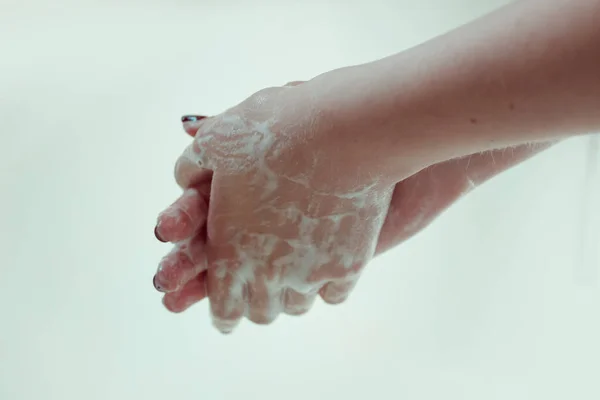 Female hands in soap. Hand wash