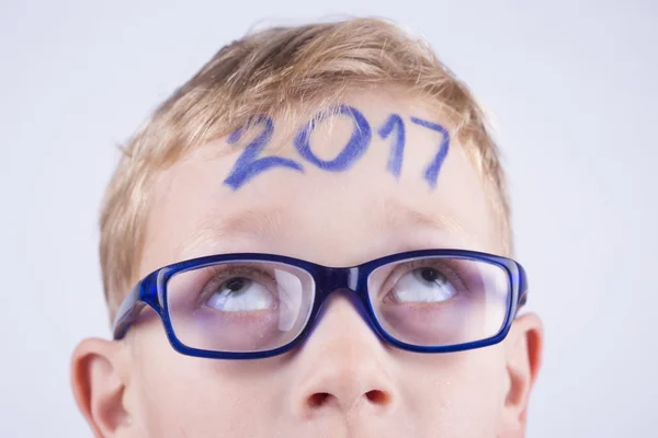 2017, number on the head of young boy — Stock Photo, Image