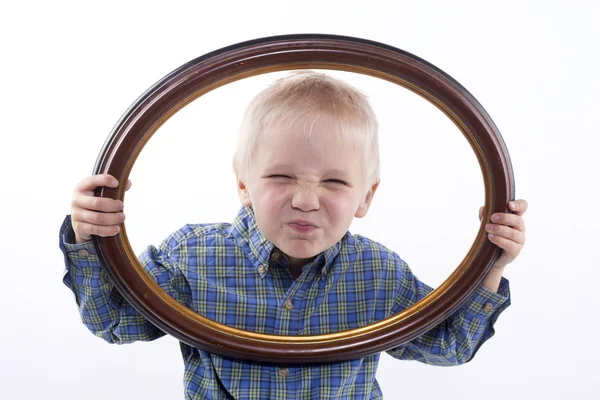 Boy holding frame — Stock Photo, Image