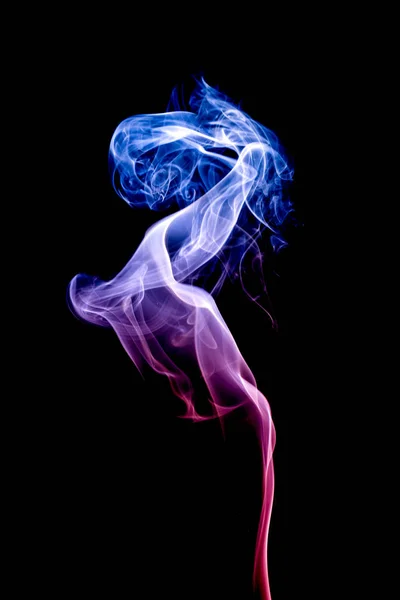 Colorful smoke on dark background — Stock Photo, Image