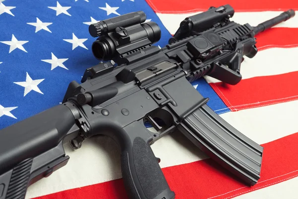 Ruffled national flag with machine gun over it series - United States — Stock Photo, Image