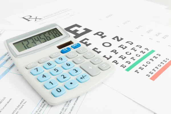 Table for eyesight test and medical prescription form with calculator neat it series — Stock Photo, Image