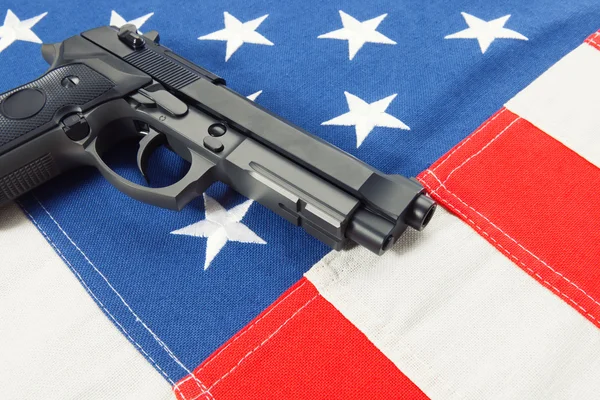 Ruffled cotton flag with hand gun over it series - United States of America — Stock Photo, Image