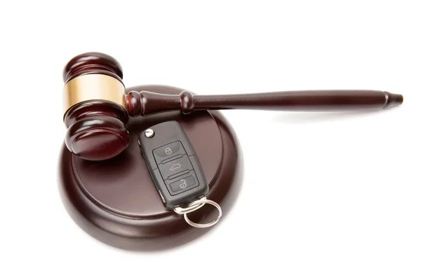 Close up of judge gavel and car keys over soundboard — Stock Photo, Image