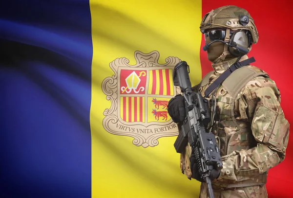 Soldier in helmet holding machine gun with flag on background series - Andorra — Stock Photo, Image
