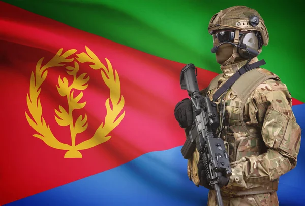 Soldier in helmet holding machine gun with flag on background series - Eritrea — Stok Foto