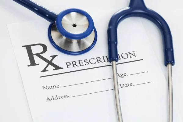 Medical prescription form with stethoscope over it — Stock Photo, Image