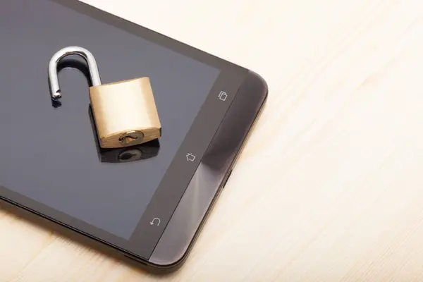 Smartphone with an unlocked lock over it. Mobile phone security and data protection concept — Stock Photo, Image