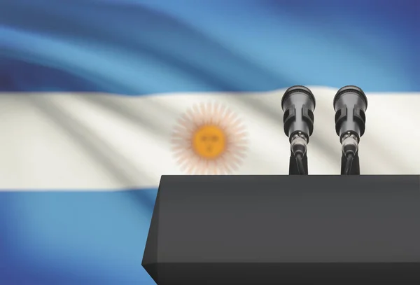 Амвон и два микрофона с флагом на фоне - Аргентина — стоковое фото