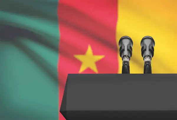Pulpit and two microphones with a national flag on background - Cameroon — Stock Photo, Image