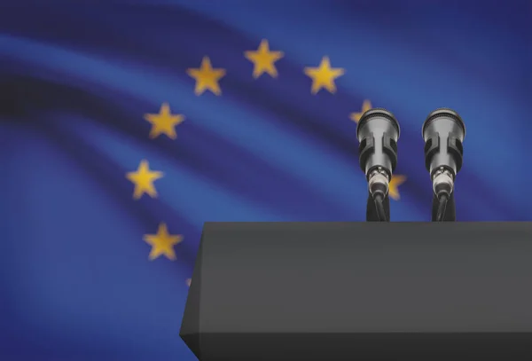 Άμβωνας και δύο μικρόφωνα με μια εθνική σημαία σε φόντο - Ευρωπαϊκή Ένωση — Φωτογραφία Αρχείου
