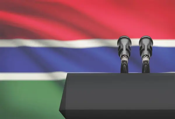 Pulpit and two microphones with a national flag on background - Gambia — Stock Photo, Image