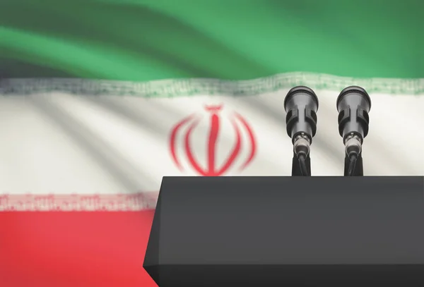 Szószék és a két mikrofon egy nemzeti zászló, a háttér - Irán — Stock Fotó