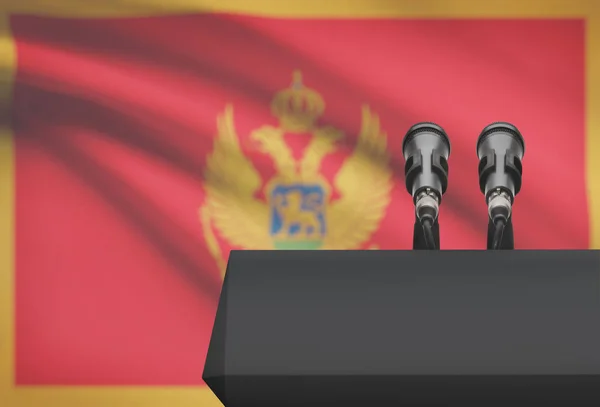 Kanzel und zwei Mikrofone mit einer Nationalflagge auf Hintergrund - Montenegro — Stockfoto
