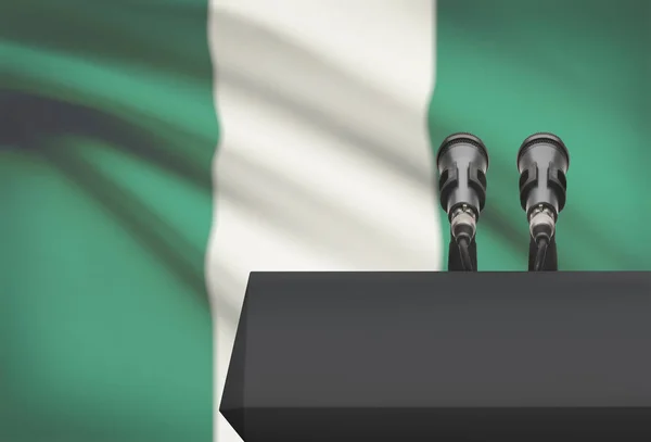 Balcon avant et deux microphones avec un drapeau national sur fond - Nigéria — Photo