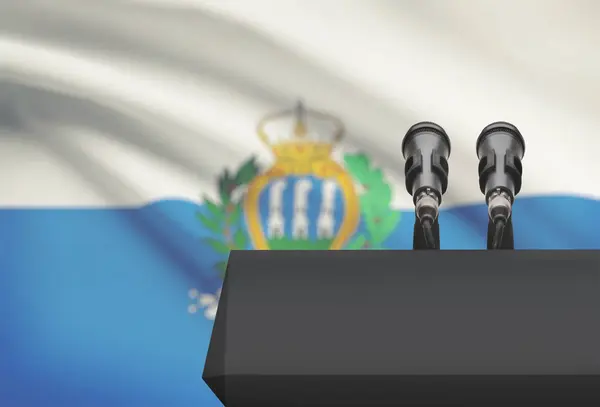 Кафедри і два мікрофони з національного прапора на фоні - Сан-Марино — стокове фото